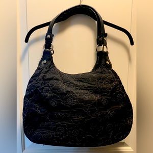 Thirty one purse in black with white poppy stitched floral pattern